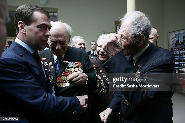 Russian President Dmitry Medvedev meets veterans of World War II during his visit to Mamayev Hill Eternal Flame war memorial, on March 25, 2010 in...