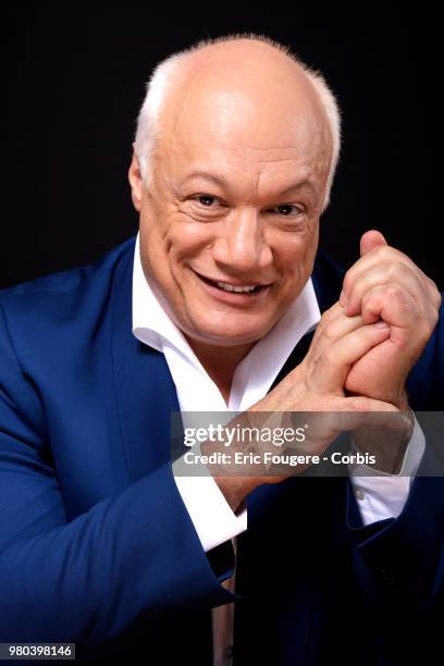 Writer Eric-Emmanuel Schmitt poses during a portrait session in Paris, France on .