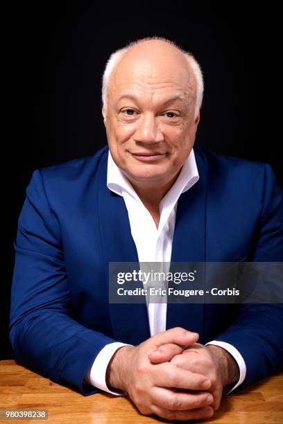 Writer Eric-Emmanuel Schmitt poses during a portrait session in Paris, France on .