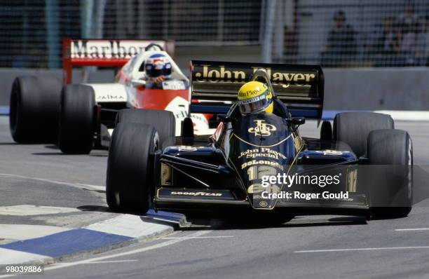 Ayrton Senna drives the John Player Special Lotus-Renault 98Tahead of Keke Rosberg in the Marlboro McLaren-TAG MP4/2C during the Australian Grand...