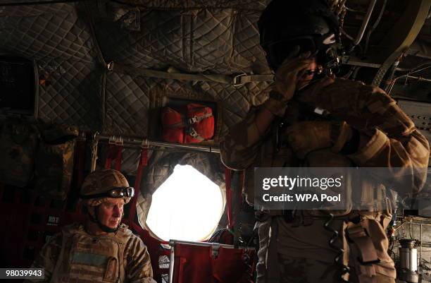 Prince Charles, Prince of Wales looks through the window of a British military helicopter enroute to Lashkar Gah on March 25, 2010 in Afghanistan....