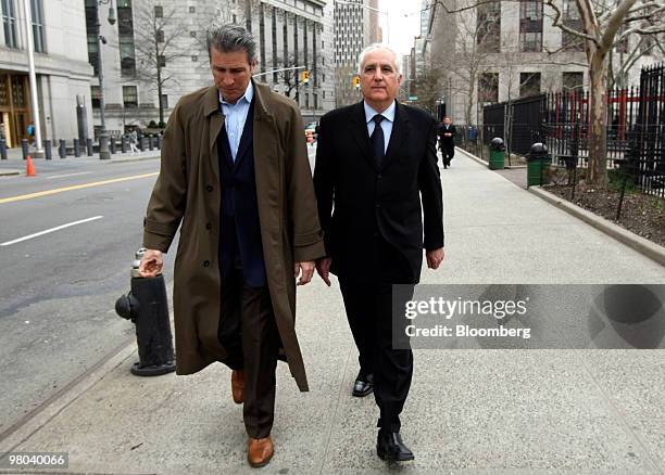 Daniel Bonventre, former director of operations for Bernard Madoff Investment Securities LLC, right, leaves federal court in New York, U.S., on...