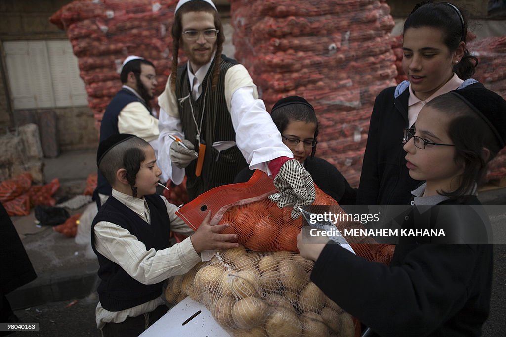 Ultra-Orthodox Jews carry donated food f