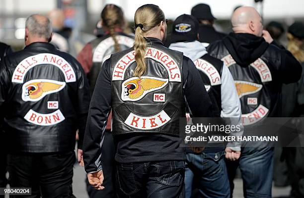 Members of the motorcycle gang �Hells Angels� leave the district court in Duisburg, western Germany after attending the trail of a Hells Angels...
