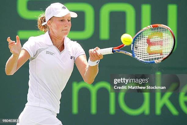 Ekaterina Makarova of Russia returns a shot against Agnieszka Radwanska of Poland during day three of the 2010 Sony Ericsson Open at Crandon Park...