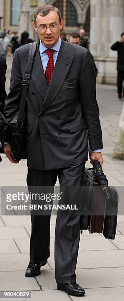 Former bank executive Raphael Geys leaves the High Court in central London, on March 25 after a claim against his former employer French bank Societe...
