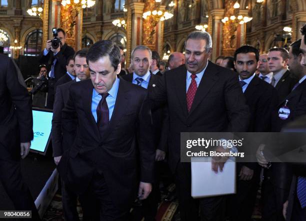 Francois Fillon, France's prime minister, left, and Sheik Hamad bin Jassim bin Jabor Al Thani, Qatar's prime minister, arrive for the fifth Finance...