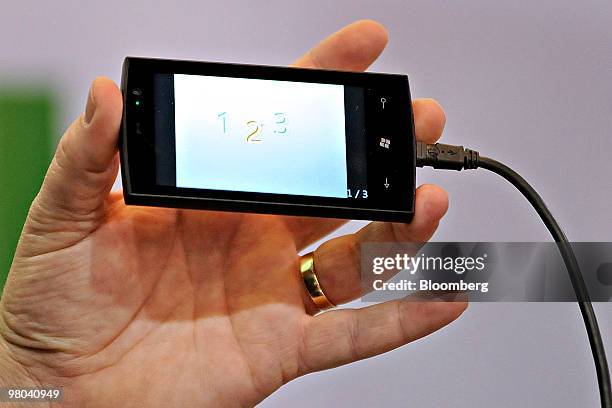 Microsoft Corp.'s Windows 7 Series prototype phone is demonstrated during the Cellular Telecommunications Industry Association 2010 convention in Las...