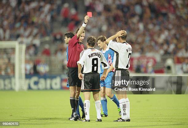 Referee Rune Pedersen showing the red card and sending off Christian Woerns of Germany during the1998 FIFA World Cup Quarter Final match against...