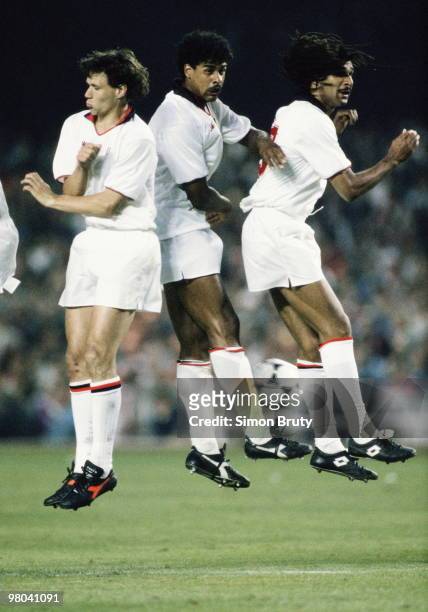 Marco Van Basten Frank Rijkaard and Ruud Gullit of AC Milan on 24 May 1989 jump in the air during the European Cup Final match against Steaua...