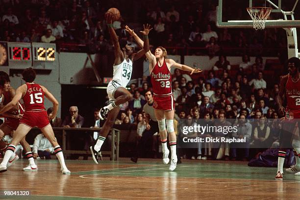 Bill Walton of the Portland Trail Blazers blocks a shot attempt by Bob Bigelow of the Boston Celtics during a game played in 1977 at the Boston...