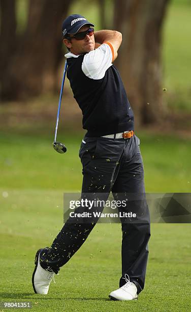 Ignacio Garrido of Spain plays his second shot into the 12th green during the first round of the Open de Andalucia 2010 at Parador de Malaga Golf on...