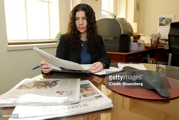 Elaine C. Greenberg, branch chief of the Philadelphia Regional Office of the U.S. Securities and Exchange Commission, looks through newspapers at the...