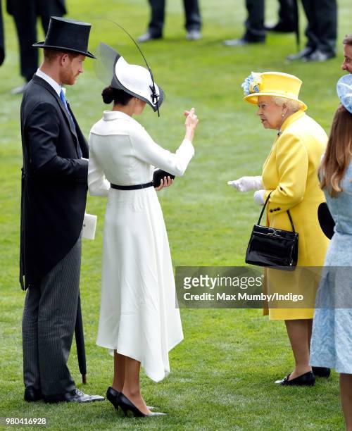 Prince Harry, Duke of Sussex, Meghan, Duchess of Sussex and Queen Elizabeth II attend day 1 of Royal Ascot at Ascot Racecourse on June 19, 2018 in...