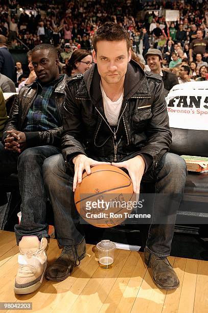 Actor Shane West, sitting courtside, poses for a portrait during a break in the game between the Atlanta Hawks and the Toronto Raptors on March 17,...