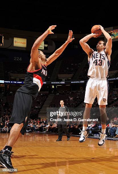 Kris Humphries of the New Jersey Nets takes a jump shot against Juwan Howard of the Portland Trail Blazers during the game on February 23, 2010 at...