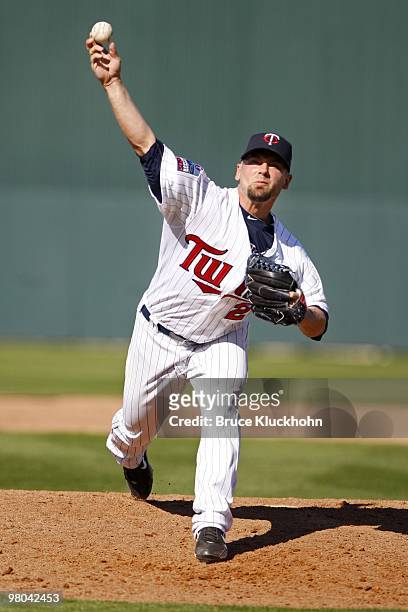 Jesse Crain of the Minnesota Twins pitches in warm-ups in the game against the New York Yankees on March 7, 2010 at Hammond Stadium in Fort Myers,...