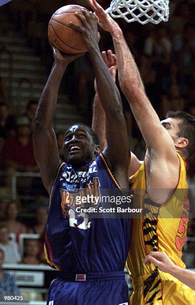 Ya Ya Dia of West Sydney is confronted by Mark Bradtke of Melbourne Tigers during the National Basketball League match between the West Sydney...
