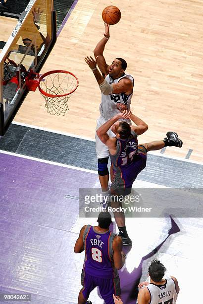 Sean May of the Sacramento Kings puts a shot up over Louis Amundson of the Phoenix Suns during the game on February 5, 2010 at Arco Arena in...
