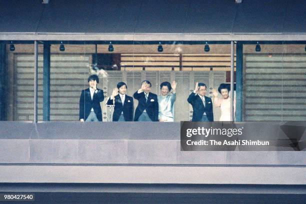 Prince Fumihito, Prince Naruito, Crown Prince Akihito, Crown Princess Michiko, Prince Hitachi and Princess Hanako of Hitachi wave to well-wishers...