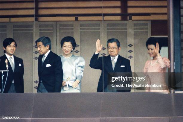 Prince Naruito, Crown Prince Akihito, Crown Princess Michiko, Prince Hitachi and Princess Hanako of Hitachi wave to well-wishers from a balcony at...