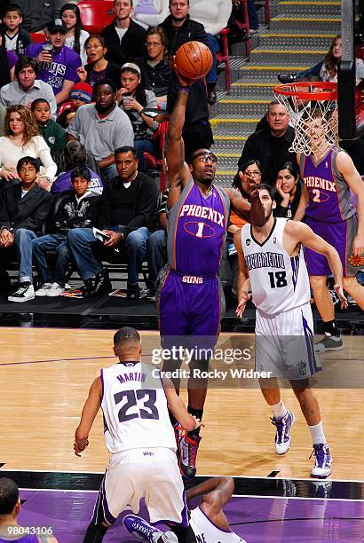 Amar'e Stoudemire of the Phoenix Suns puts a shot up over Kevin Martin and Omri Casspi of the Sacramento Kings during the game on February 5, 2010 at...