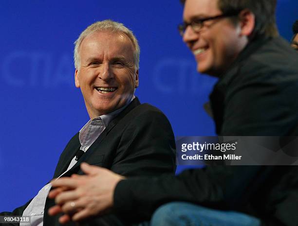 Film director James Cameron and Twitter co-founder Biz Stone laugh during a round-table discussion at the International CTIA Wireless 2010 convention...