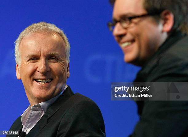 Film director James Cameron and Twitter co-founder Biz Stone laugh during a round-table discussion at the International CTIA Wireless 2010 convention...