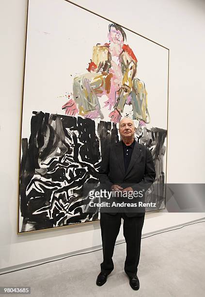 German painter Georg Baselitz poses for the media in front of his painting 'Ein moderner Maler' at the Berlinische Galerie on March 25, 2010 in...