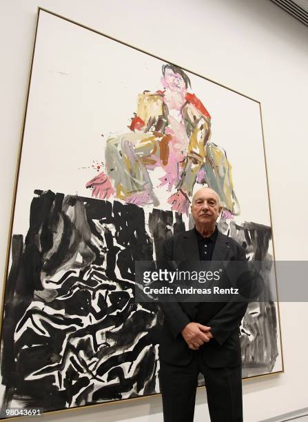German painter Georg Baselitz poses for the media in front of his painting 'Ein moderner Maler' at the Berlinische Galerie on March 25, 2010 in...