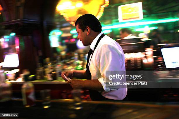 Carlos, a bartender, makes drinks at the historic Kentucky Club on March 23, 2010 in Juarez, Mexico. The Kentucky Club, once a thriving establishment...