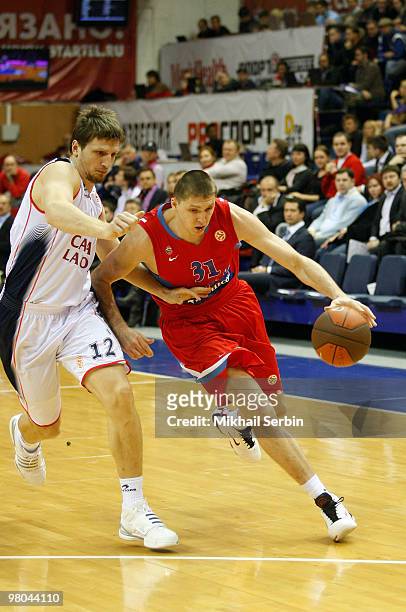 Viktor Khryapa, #31 of CSKA Moscow competes with Mirza Teletovic, #12 of Caja Laboral in action during the Euroleague Basketball 2009-2010 Play Off...