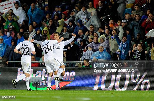 Real Madrid's Portuguese forward Cristiano Ronaldo , Real Madrid's midfielder Esteban Granero and Real Madrid's midfielder Xabi Alonso celebrate...