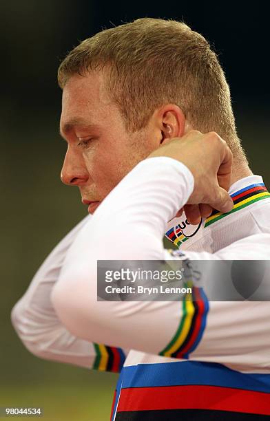Sir Chris Hoy of Great Britain pulls on his rainbow jersey after winning the Men's Keirin on Day Two of the UCI Track Cycling World Championships at...