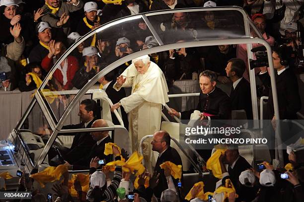 Pope Benedict XVI blesses pilgrims as he arrive in his pope mobile for his meeting with the youth of Rome and the Lazio region in preparation for...