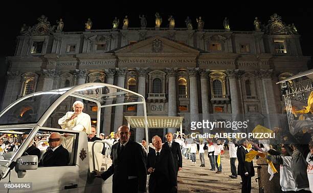 Pope Benedict XVI waves after a meeting with the youth of Rome and the Lazio region in preparation for World Youth Day in St.Peters square at the...