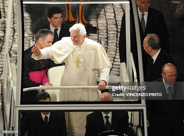 Pope Benedict XVI waves after a meeting with the youth of Rome and the Lazio region in preparation for World Youth Day in St.Peters square at the...