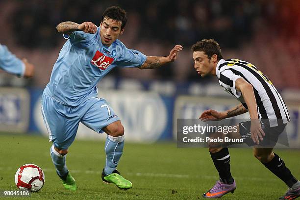 Claudio Marchisio of Juventus FC and Ezequiel Lavezzi of SSC Napoli in action during the Serie A match between SSC Napoli and Juventus FC at Stadio...