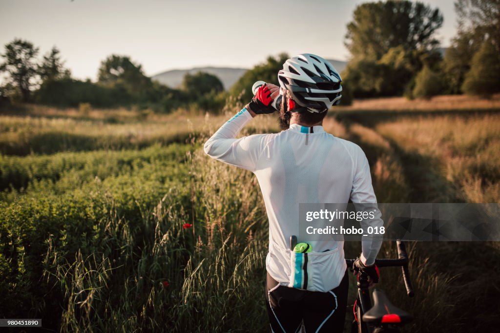 Cyclist taking a rest after long ride