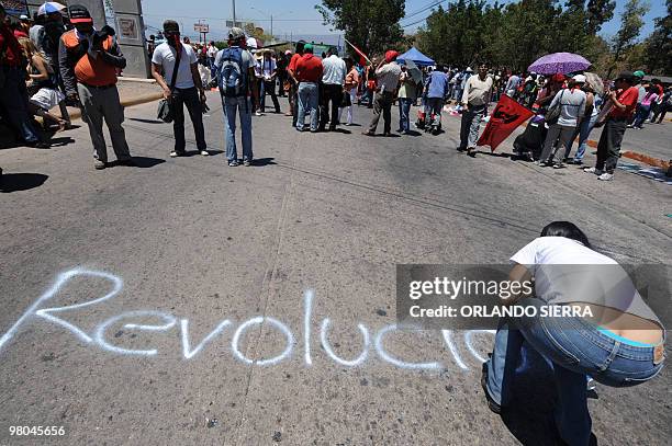 Frente Nacional de Resistencia Popular activists, students and teachers march in protest March 25, 2010 in Tegucigalpa against the possible closure...