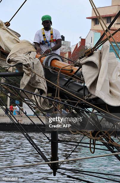 Member of the crew of the ship modelled after the famous slave-trading vessel La Amistad -- on which 53 African slaves revolted in 1839 -- takes down...