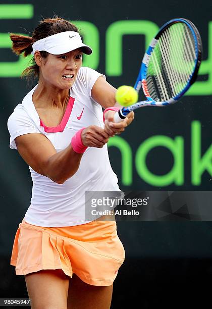 Na Li of China returns a shot against Timea Bacsinszky of Switzerland during day three of the 2010 Sony Ericsson Open at Crandon Park Tennis Center...