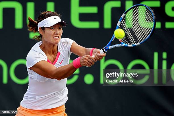 Na Li of China returns a shot against Timea Bacsinszky of Switzerland during day three of the 2010 Sony Ericsson Open at Crandon Park Tennis Center...