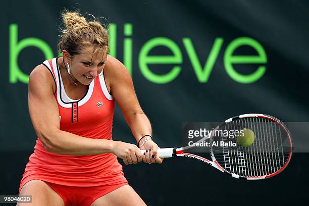 Timea Bacsinszky of Switzerland returns a shot against Na Li of China during day three of the 2010 Sony Ericsson Open at Crandon Park Tennis Center...
