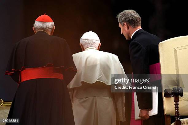 Pope Benedict XVI framed by his personal secretary Georg Ganswein and a Cardinal leaves St. Peter's square at the end of a meeting with the Rome's...