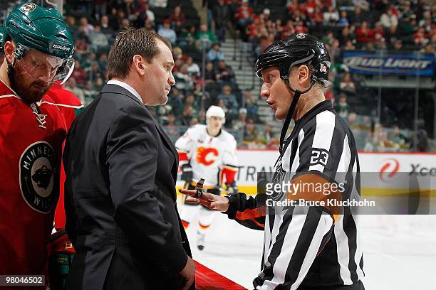 Minnesota Wild Head Coach Todd Richards talks with referee Brad Watson during the game against the Calgary Flames at the Xcel Energy Center on March...