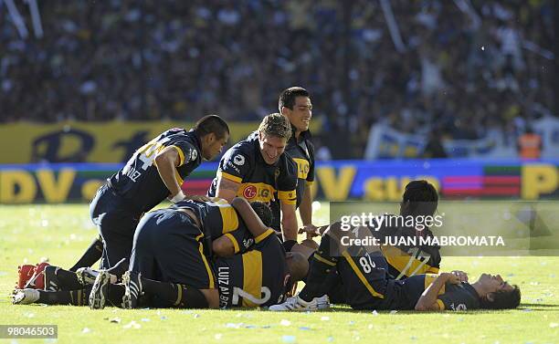 Boca Juniors' players celebrate the second goal of midfielder Jesus Mendez against River Plate during an Argentina's first division football match at...