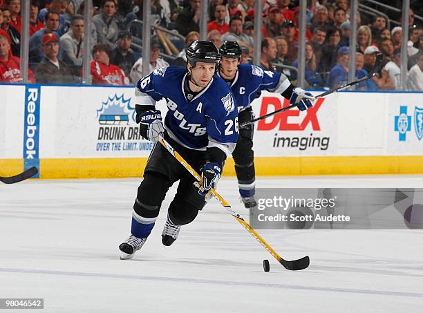 Martin St. Louis of the Tampa Bay Lightning skates with the puck against the Washington Capitals at the St. Pete Times Forum on March 20, 2010 in...