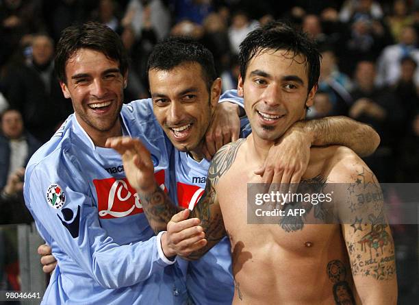 Napoli forward Ezequiel Lavezzi celebrates with his teammates Fabio Quagliarella and Christian Maggio during their football Serie A Match SSC Napoli...