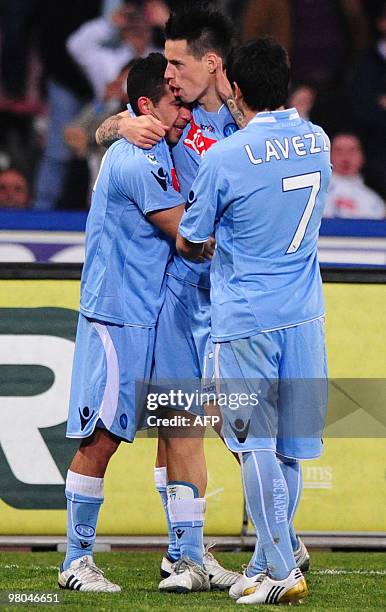 Napoli forward Marek Hamsik celebrates with his teammates Ezequiel Lavezzi and Walter Gargano after scoring during their football Serie A Match SSC...